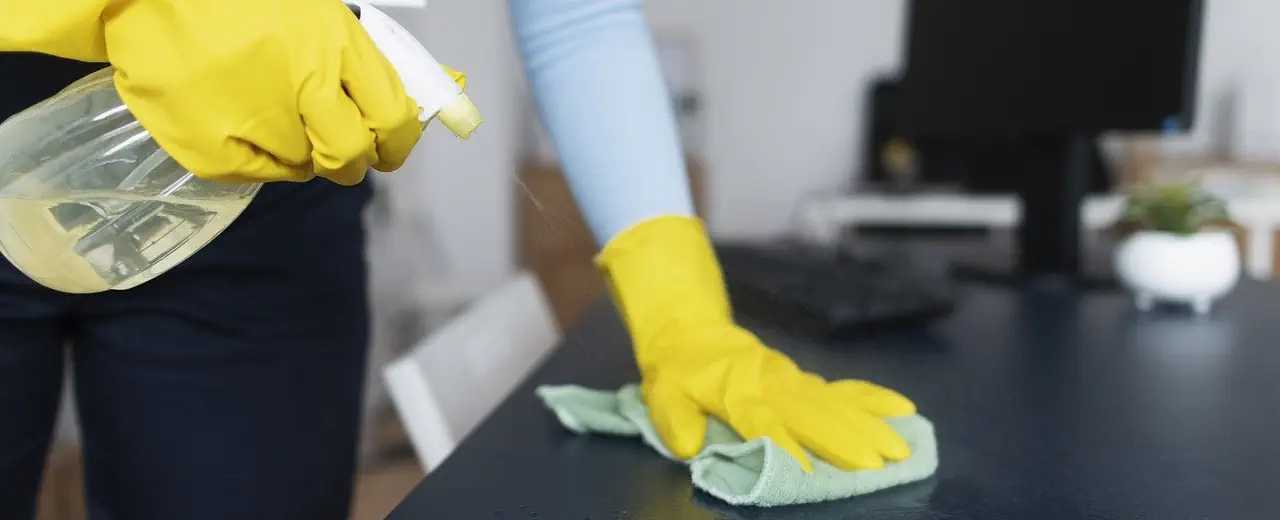 Hands cleaning a desk. Office cleaning. Jessica's cleaning.